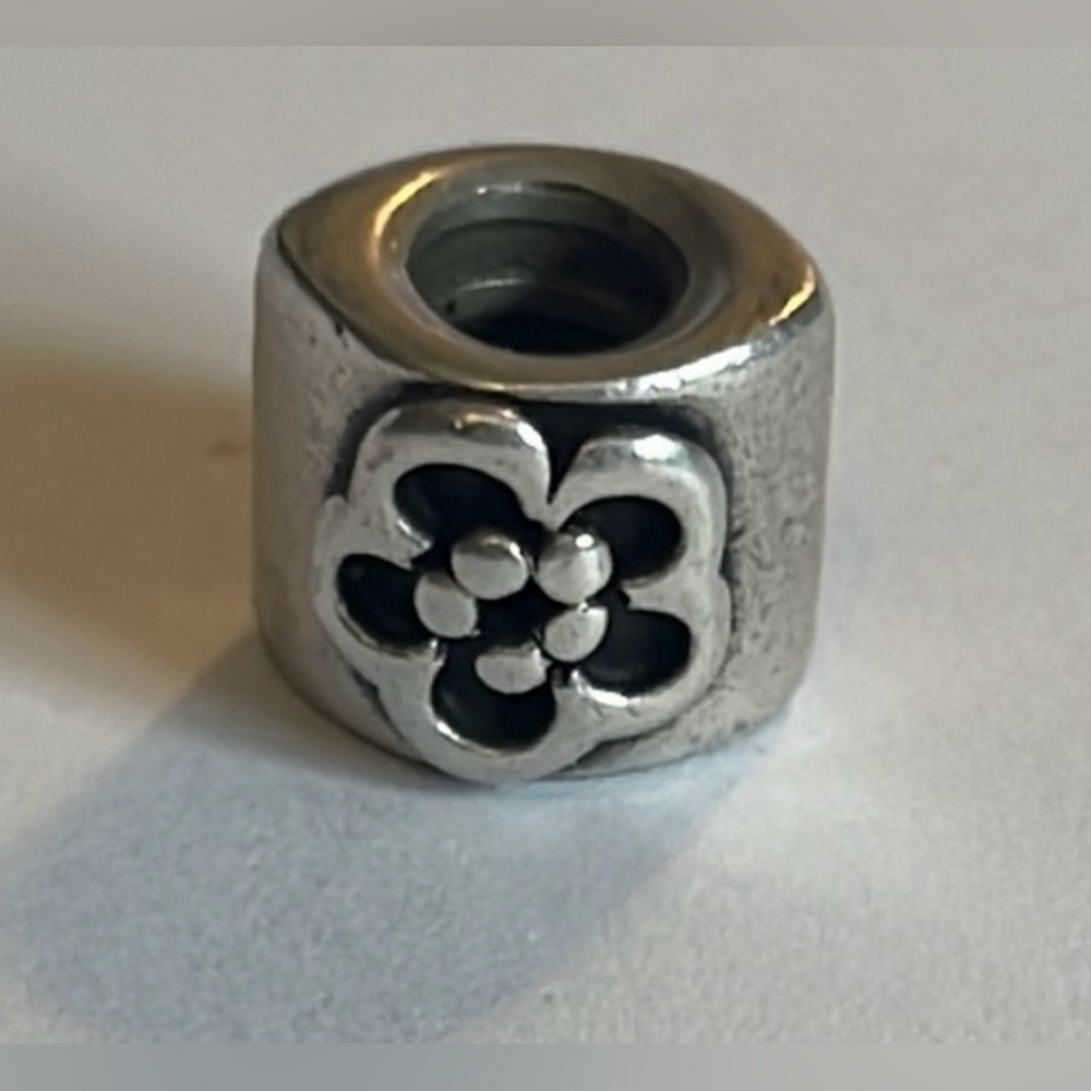 Pandora silver thick spacer charm with a flower on each side